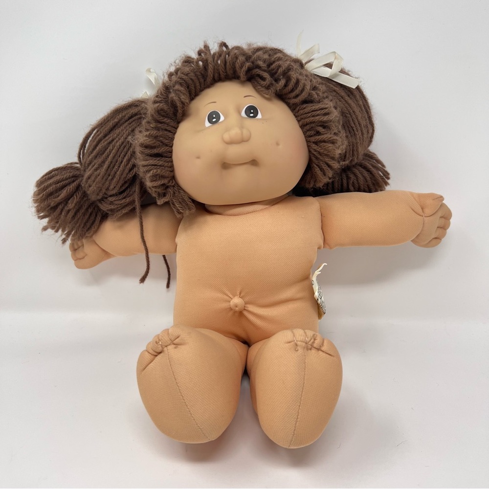 Cabbage patch doll, girl, brown hair, pig tails